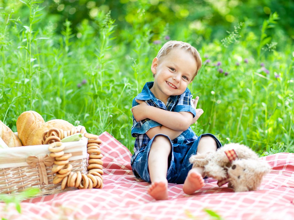 little-cute-boy-sits-plaid-plays-with-his-teddy-bear.jpg